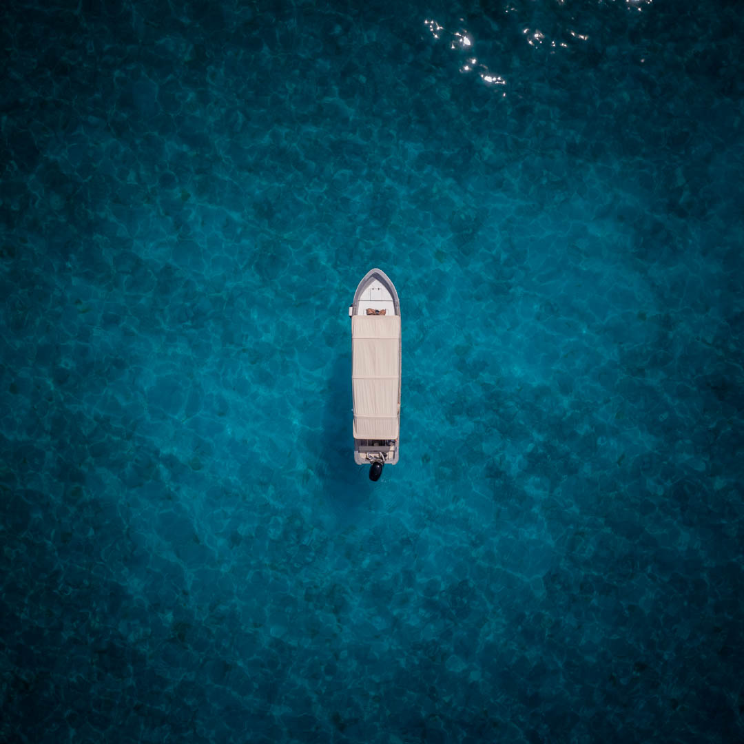 Private speedboat in Raja Ampat's crystal clear waters