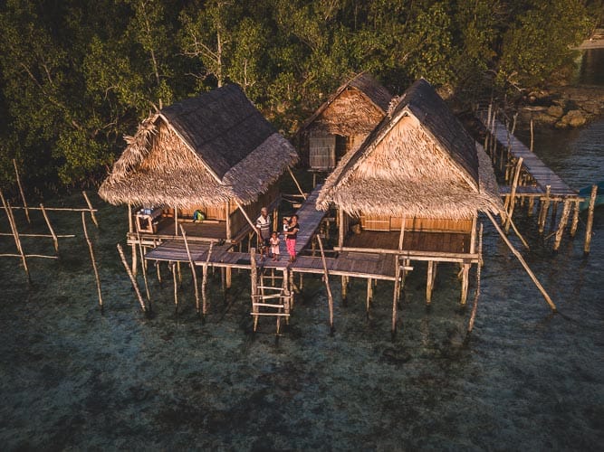 Overwater bungalows on Gam island in Raja Ampat
