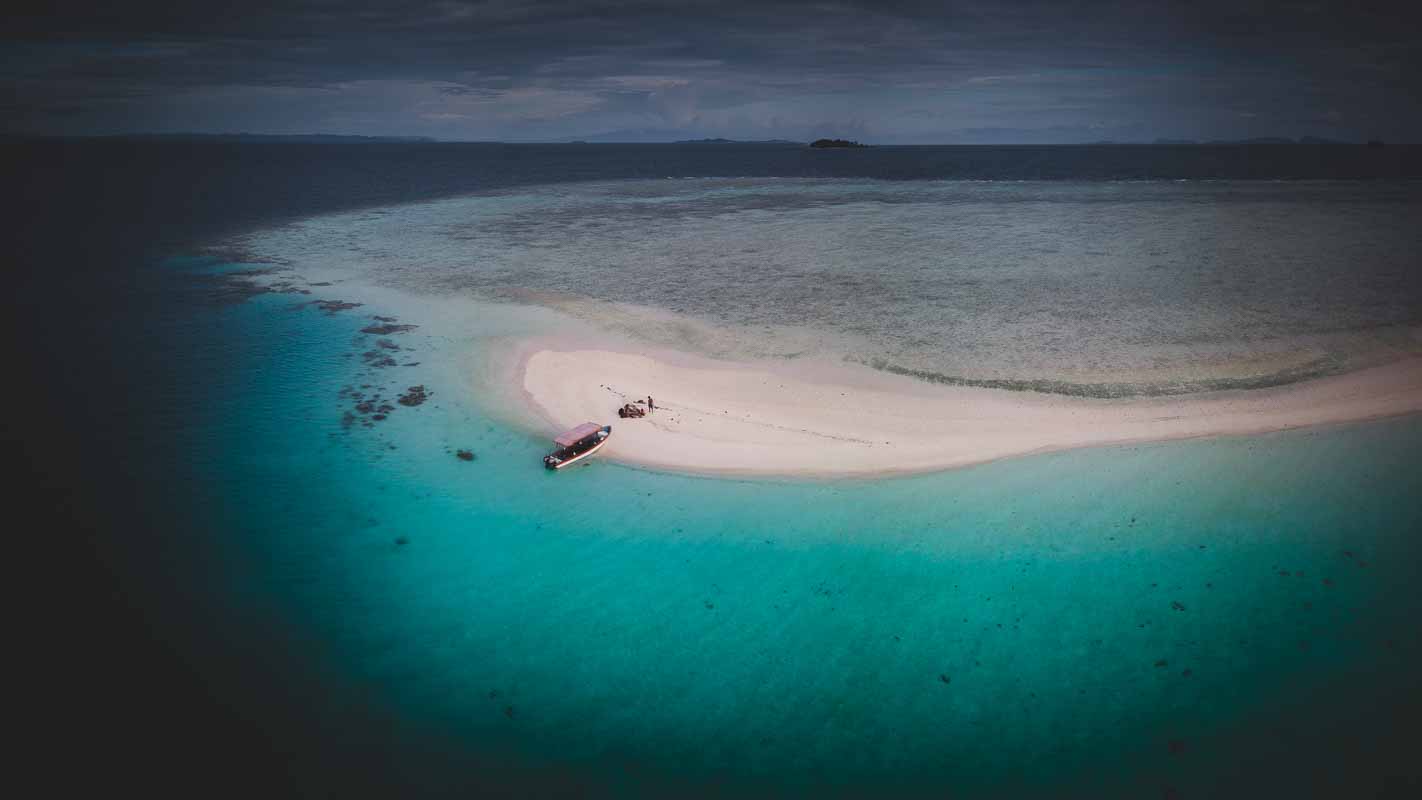 A Sandbank emerging from Raja Ampat's tropical waters